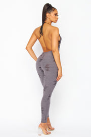 DISTRESSED JERSEY HALTER JUMPSUIT